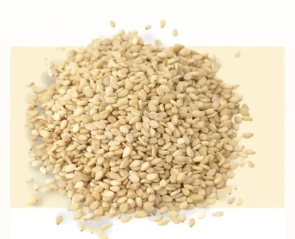 A mound of pale hulled sesame seeds